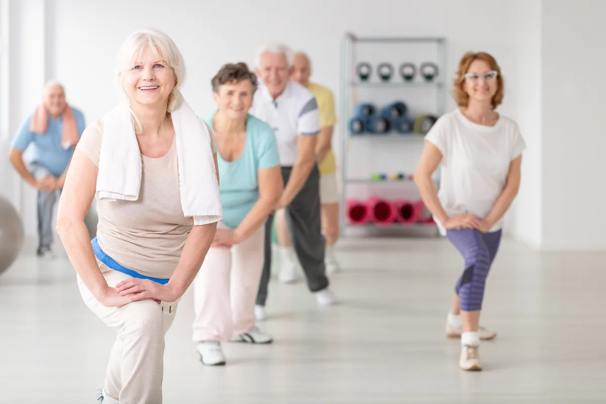 Older adults taking part in a group exercise class