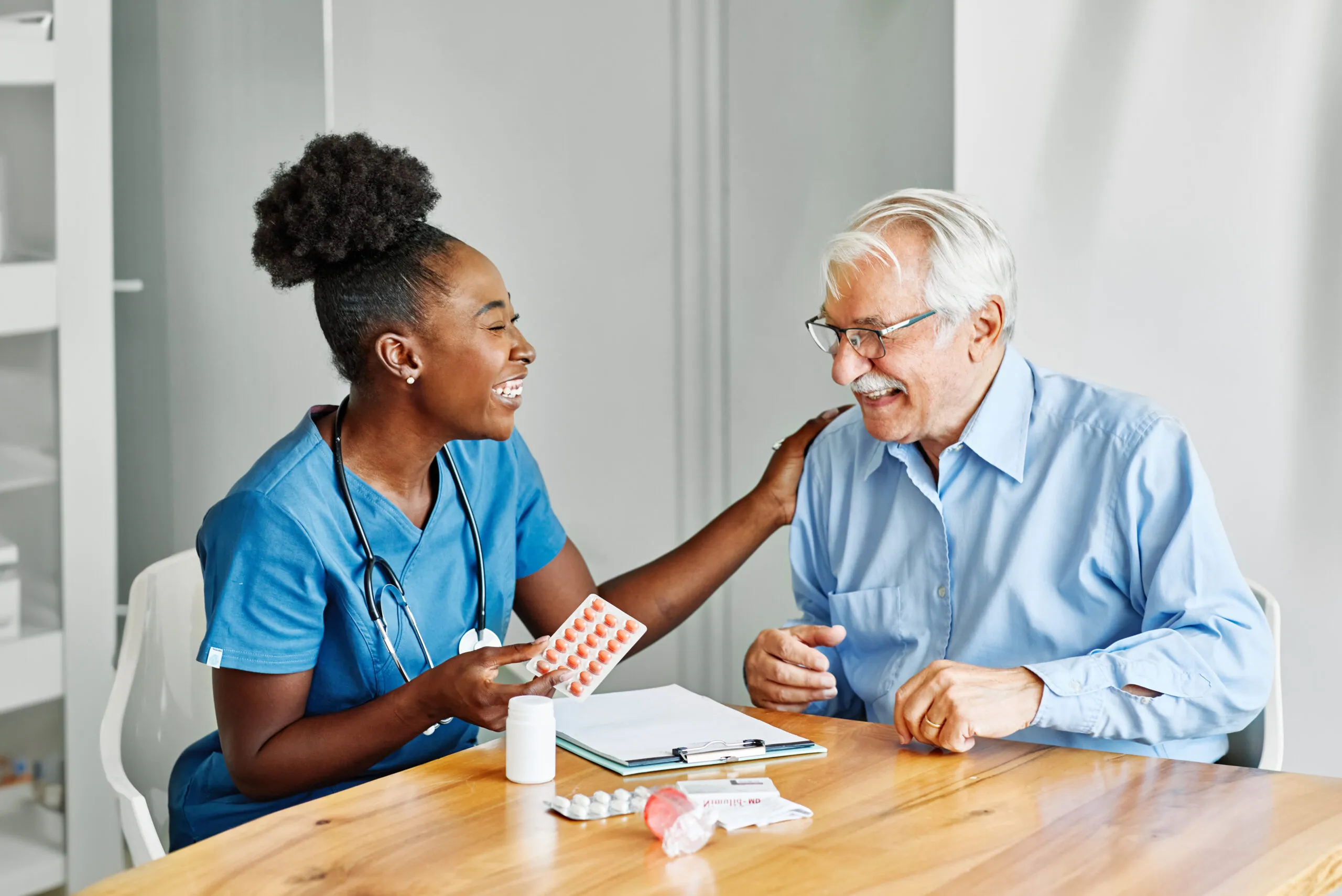 A cheerful caregiver assisting an elderly woman in her San Antonio home – san antonio senior home care